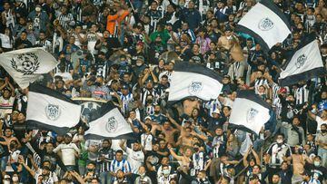 Monterrey&#039;s fans cheer for their team during the Mexican Apertura tournament football match against Atlas at BBVA Bancomer stadium in Monterrey, Mexico, on November 24, 2021. (Photo by Julio Cesar AGUILAR / AFP)