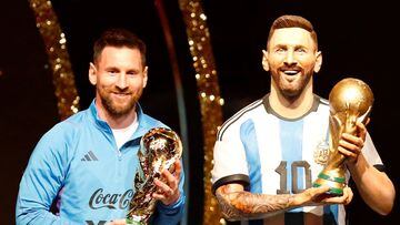 Soccer Football - Copa Libertadores - Draw - Conmebol headquarters, Luque, Paraguay - March 27, 2023 Argentina's Lionel Messi poses with a statue of himself holding the World Cup during the Conmebol event. REUTERS/Cesar Olmedo