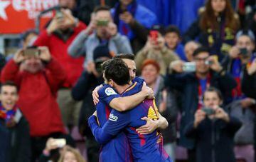 Lionel Messi celebrates scoring Barcelona's first goal against Celta Vigo with Jordi Alba.