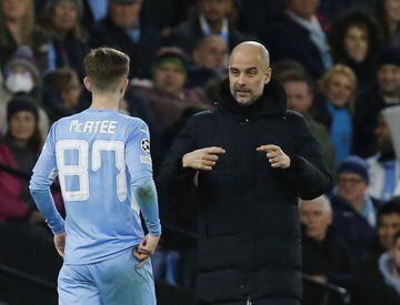 Soccer Football - Champions League - Round of 16 Second Leg - Manchester City v Sporting CP - Etihad Stadium, Manchester, Britain - March 9, 2022 Manchester City manager Pep Guardiola talks to James Mcatee REUTERS/Craig Brough