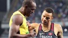 Usain Bolt, con Andre de Grasseal final de los 200 metros.