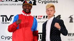 This handout photograph taken by Rizin Fighting Federation on November 5, 2018 shows US boxer Floyd Mayweather Jr. (L) posing with his opponent, Japanese kickboxer Tenshin Nasukawa (R) during a press conference to announce their fight. - Boxing superstar 