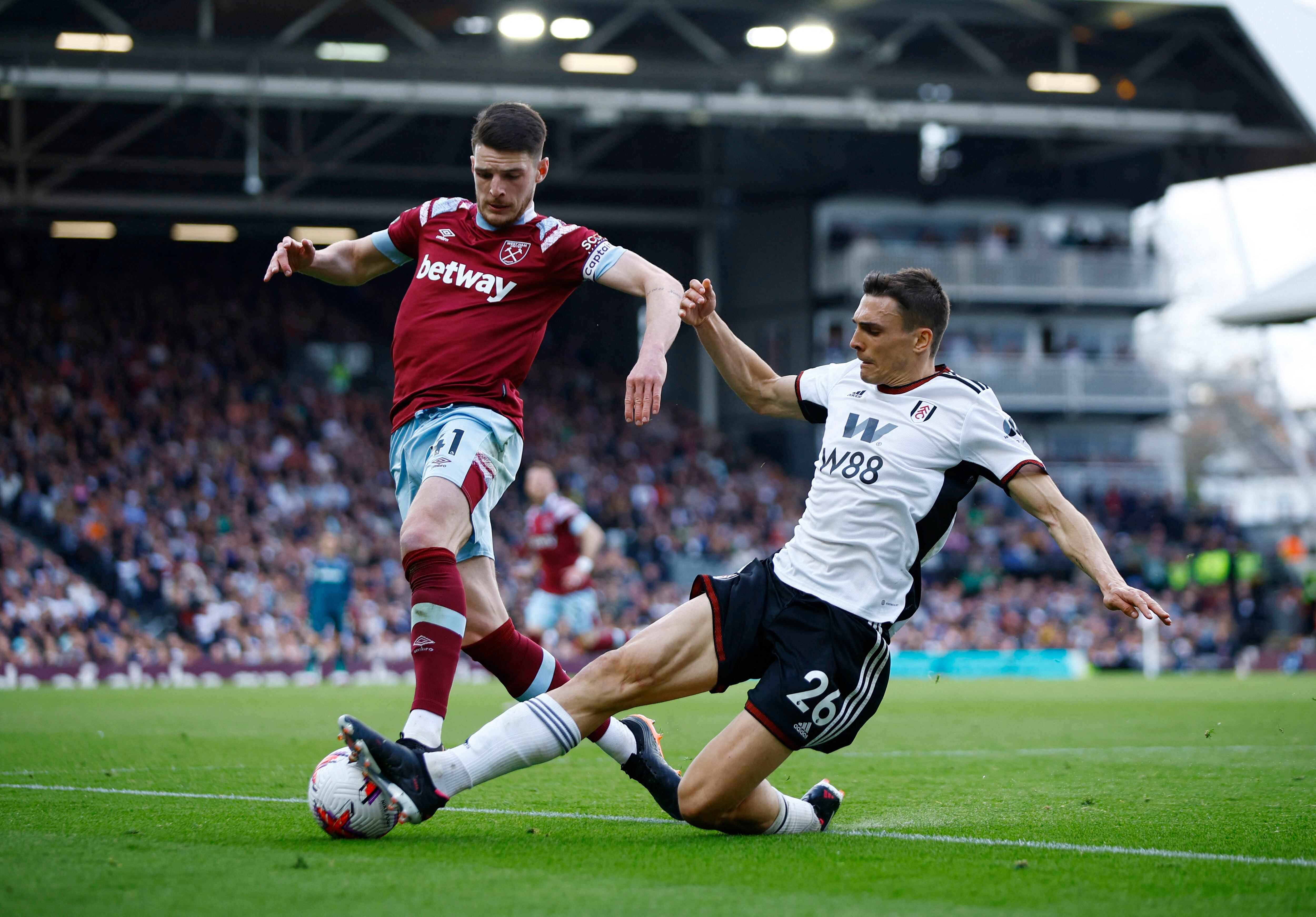 Soccer Football - Premier League - Fulham v West Ham United - Craven Cottage, London, Britain - April 8, 2023 West Ham United's Declan Rice in action with Fulham's Joao Palhinha Action Images via Reuters/John Sibley EDITORIAL USE ONLY. No use with unauthorized audio, video, data, fixture lists, club/league logos or 'live' services. Online in-match use limited to 75 images, no video emulation. No use in betting, games or single club /league/player publications.  Please contact your account representative for further details.