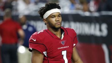 Oklahoma quarterback Kyler Murray holds his up a jersey after the Arizona  Cardinals selected Mu …