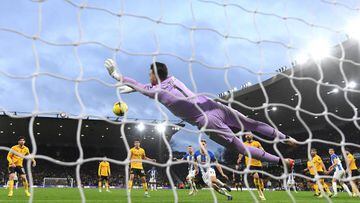 WOLVERHAMPTON, ENGLAND - NOVEMBER 05: Jose Sa of Wolverhampton Wanderers makes a save during the Premier League match between Wolverhampton Wanderers and Brighton & Hove Albion at Molineux on November 05, 2022 in Wolverhampton, England. (Photo by Mike Hewitt/Getty Images)