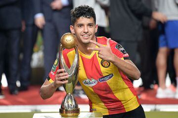 ES Tunis goal scorer Saad Beguir poses with the CAF Champions League trophy 