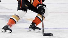 LAS VEGAS, NEVADA - JANUARY 16: Jakob Silfverberg #33 of the Anaheim Ducks skates with the puck ahead of Cody Glass #9 of the Vegas Golden Knights in the first period of their game at T-Mobile Arena on January 16, 2021 in Las Vegas, Nevada. The Golden Kni