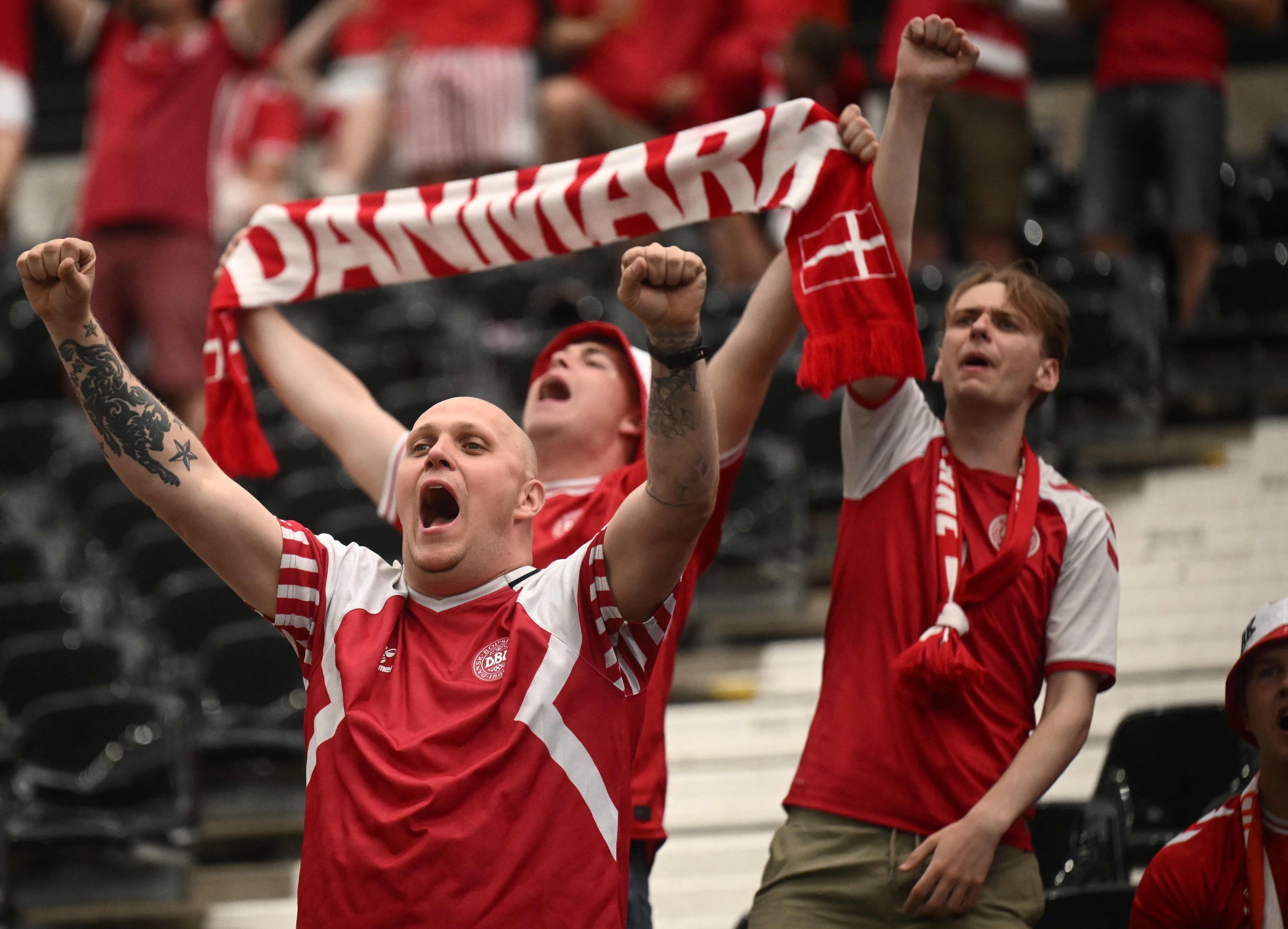 Denmark fans cheer prior to the UEFA Euro 2024 Group C football match between Denmark and England at the Frankfurt Arena in Frankfurt am Main on June 20, 2024. (Photo by Angelos TZORTZINIS / AFP)