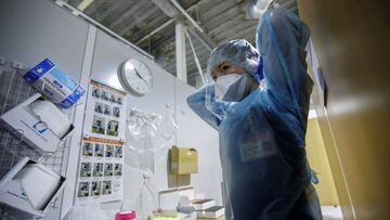 A medical worker wearing a protective suit prepares for a polymerase chain reaction (PCR) test at newly-opened Narita International Airport PCR Center operated by Nippon Medical School Foundation, a coronavirus disease (COVID-19) testing facility aimed at
