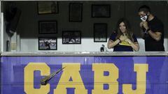 Dalma Maradona, left, daughter of Diego Maradona, smiles from her father&#039;s box at the end of a local tournament match between Boca Juniors and Newell&#039;s Old Boys at the Alberto J. Armando Stadium in Buenos Aires, Argentina, Sunday, Nov. 29, 2020. The Argentine soccer great died from a heart attack at his home Wednesday, Nov. 25, at the age of 60. (Alejandro Pagni/Pool Photo via AP)