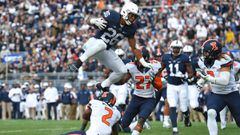 Oct 31, 2015; University Park, PA, USA; Penn State Nittany Lions running back Saquon Barkley (26) leaps over Illinois Fighting Illini defensive back V&#039;Angelo Bentley (2) during the fourth quarter at Beaver Stadium.  Mandatory Credit: Rich Barnes-USA TODAY Sports