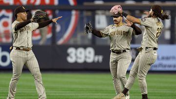 NEW YORK, NEW YORK - MAY 26: Juan Soto #22,Trent Grisham #1 and Fernando Tatis Jr. #23 of the San Diego Padres celebrate the win over the New York Yankees at Yankee Stadium on May 26, 2023 in Bronx borough of New York City. The San Diego Padres defeated the New York Yankees 5-1.   Elsa/Getty Images/AFP (Photo by ELSA / GETTY IMAGES NORTH AMERICA / Getty Images via AFP)