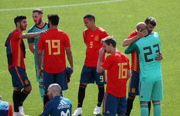 Spain's players share a joke before their official photo.