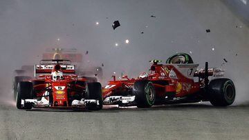 SINGAPORE - SEPTEMBER 17:  Sebastian Vettel of Germany driving the (5) Scuderia Ferrari SF70H and Kimi Raikkonen of Finland driving the (7) Scuderia Ferrari SF70H collide at the start during the Formula One Grand Prix of Singapore at Marina Bay Street Circuit on September 17, 2017 in Singapore.  (Photo by Lars Baron/Getty Images)