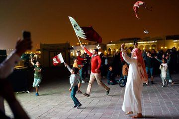 Qatari fans cheer after their national team defeated UAE to qualify to the final of the 2019 AFC Asian Cup on January 29, 2019, in the Qatari capital Doha