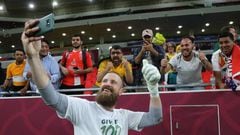 Australia's goalkeeper Andrew Redmayne poses for a selfie with fans after winning the FIFA World Cup 2022 inter-confederation play-offs match between Australia and Peru on June 13, 2022, at the Ahmed bin Ali Stadium in the Qatari city of Ar-Rayyan. - Australia beat Peru in a sudden death penalty shootout to secure the penultimate free place at the 2022 World Cup finals. (Photo by KARIM JAAFAR / AFP) (Photo by KARIM JAAFAR/AFP via Getty Images)