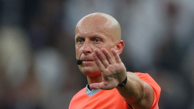 Who is Szymon Marciniak, the referee for Borussia Dortmund vs AC Milan in the Champions League?