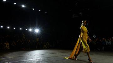 SYDNEY, AUSTRALIA - MAY 11: A model walks the runway in a design by Cue during Afterpay's Future of Fashion show during Afterpay Australian Fashion Week 2022 Resort '23 Collections at Carriageworks on May 11, 2022 in Sydney, Australia. (Photo by Caroline McCredie/Getty Images)