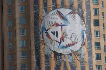 A large picture of the FIFA World Cup official ball 'al Rihla' is displayed on a building in Doha 
