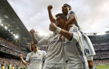 Cristiano Ronaldo celebrates the first of his three goals with his Real Madrid team-mates.