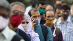 People wearing protective masks wait in line to board a bus amidst the spread of the coronavirus disease (COVID-19) in Mumbai, India, October, 6, 2020. REUTERS/Francis Mascarenhas