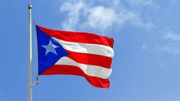 The flag of Puerto Rico flies.