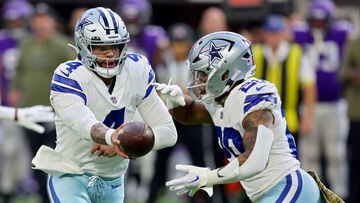 MINNEAPOLIS, MINNESOTA - NOVEMBER 20: Dak Prescott #4 of the Dallas Cowboys hands the ball off to Tony Pollard #20 of the Dallas Cowboys during the first half against the Minnesota Vikings at U.S. Bank Stadium on November 20, 2022 in Minneapolis, Minnesota.   Adam Bettcher/Getty Images/AFP (Photo by Adam Bettcher / GETTY IMAGES NORTH AMERICA / Getty Images via AFP)
