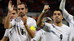 Uruguay&#039;s Luis Suarez (R) celebrates with Uruguay&#039;s Diego Godin after scoring against Chile during their South American qualification football match for the FIFA World Cup Qatar 2022 at the San Carlos de Apoquindo Stadium in Santiago on March 29