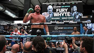 (FILES) In this file photo taken on April 19, 2022 World Boxing Council (WBC) heavyweight title holder Britain's Tyson Fury takes part in an open work-out session in Wembley, west London. - WBC heavyweight champion Tyson Fury said he is retiring from boxing on his 34th birthday on August 12, 2022, having previously performed a number of U-turns over his future in the sport. "After long hard conversations I've finally decided to walk away & on my 34th birthday I say Bon voyage," Fury posted on Twitter. (Photo by JUSTIN TALLIS / AFP)
