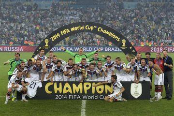 The German squad pose after winning the 2014 FIFA World Cup final against Argentina, in Rio.
