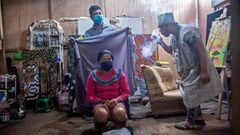 (FILES) A woman prepares to breathe steam from medicinal herbs during a healing ceremony at the Cantagallo community, where some 300 families of the Shipibo Conibo ethnic group inhabit, in Lima on June 18, 2020. - The new coronavirus pandemic is decimating Latin American indigenous communities, perfect target for the disease due to their populationx92s precarious defences and the historical neglect they are victim of. (Photo by Ernesto BENAVIDES / AFP)