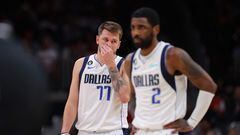 Luka Doncic #77 and Kyrie Irving #2 of the Dallas Mavericks react against the Atlanta Hawks during the second quarter at State Farm Arena on April 02, 2023 in Atlanta, Georgia.