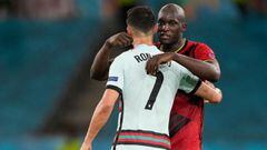 Belgium's forward Romelu Lukaku (R) embraces Portugal's forward Cristiano Ronaldo at the end of the UEFA EURO 2020 round of 16 football match between Belgium and Portugal at La Cartuja Stadium in Seville on June 27, 2021. (Photo by THANASSIS STAVRAKIS / P