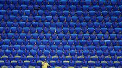 Soccer Football - International Friendly - Ukraine v Cyprus - Metalist Stadium, Kharkiv, Ukraine - June 7, 2021 A fan sits amongst empty seats inside the stadium before the match REUTERS/Gleb Garanich