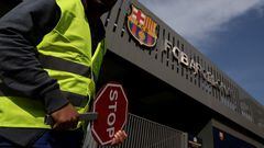 A worker holds a sign at the entrance of the Camp Nou stadium during the start of construction works to build the new Camp Nou stadium, in Barcelona, Spain June 1, 2023. REUTERS/Nacho Doce