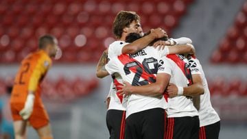 Juli&aacute;n Alvarez of Argentina&#039;s River Plate, right, celebrates with teammates scoring his side&#039;s second goal during a Copa Libertadores soccer match against Ecuador&#039;s Liga Deportiva Universitaria in Buenos Aires, Argentina, Tuesday, Oct. 20, 2020. (Agustin Marcarian/Pool via AP)
