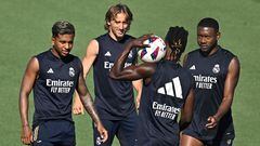 (L - R) Real Madrid's Brazilian forward #11 Rodrygo, Real Madrid's Croatian midfielder #10 Luka Modric, Real Madrid's French midfielder #12 Eduardo Camavinga and Real Madrid's Austrian defender #04 David Alaba attend a training session at the Real Madrid City training complex in Valdebebas, outskirts of Madrid, on August 24, 2023. (Photo by JAVIER SORIANO / AFP)