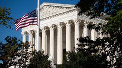 The American flag flies at half staff for late US Supreme Court Justice Ruth Bader Ginsberg outside the US Supreme Court in Washington, DC, September 21, 2020. - Ruth Bader Ginsburg will lie in repose at the Supreme Court on September 23 and September 24,