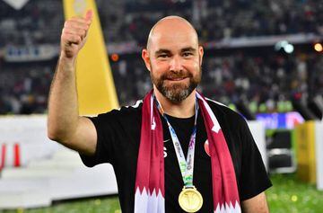 Qatar's coach Felix Sanchez gestures while wearing the gold medal following their win during the 2019 AFC Asian Cup final football match between Japan and Qatar at the Mohammed Bin Zayed Stadium in Abu Dhabi on February