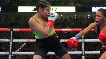 FORT WORTH, TEXAS - AUGUST 6: Eva Guzman (R) and Marlen Esparza (L) exchange strikes in their WBA, WBC and Ring Flyweight Tittle Fight at Dickies Arena on August 6, 2022 in Fort Worth, Texas. (Photo by Cris Esqueda/Golden Boy/Getty Images)
