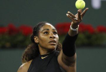 Serena Williams serves to elder sister Venus at Indian Wells