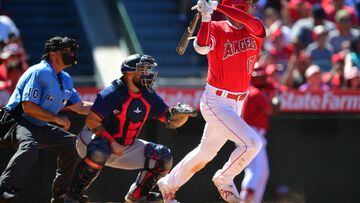 Los Angeles Angels two-way player Shohei Ohtani (L) and former Seattle  Mariners outfielder Ichiro Suzuki are pictured before a game between the  two teams on July 10, 2021, at T-Mobile Park in