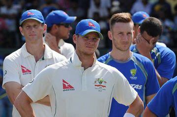 Australia's captain Steven Smith and teammates look on during the presentation ceremony after Sri Lanka's victory.
