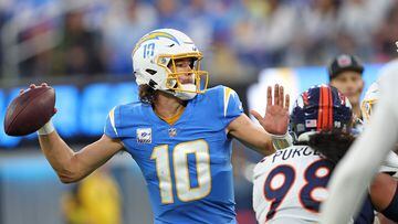 INGLEWOOD, CALIFORNIA - OCTOBER 17: Justin Herbert #10 of the Los Angeles Chargers looks to pass during the second quarter against the Denver Broncos at SoFi Stadium on October 17, 2022 in Inglewood, California.   Sean M. Haffey/Getty Images/AFP