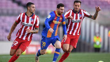BARCELONA, SPAIN - MAY 08: Lionel Messi of FC Barcelona is put under pressure by Mario Hermoso (L) and Sauel Niguez (R) of Atletico Madrid  during the La Liga Santander match between FC Barcelona and Atletico de Madrid at Camp Nou on May 08, 2021 in Barce