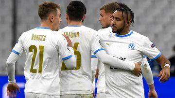 Marseille&#039;s French forward Dimitri Payet (R) is congratulated by teammates after scoring a goal during the UEFA Champions League Group C football match between Olympique de Marseille (OM) and Olympiakos at the Velodrome stadium in Marseille on Decemb