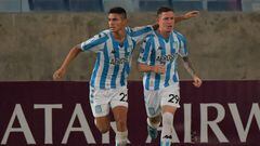 Argentina's Racing Anibal Moreno (R) celebrates with teammate Carlos Alcaraz after scoring against Brazil's Cuiaba during the Copa Sudamericana group stage football match at the Pantanal Arena in Cuiaba, Brazil, on May 3, 2022. (Photo by NELSON ALMEIDA / AFP) (Photo by NELSON ALMEIDA/AFP via Getty Images)