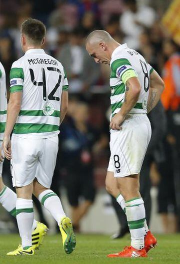 Celtic's Scott Brown, right, and Callum McGregor leave the pitch at the end of a Champions League, Group C soccer match between Barcelona and Celtic, at the Camp Nou stadium in Barcelona, Spain, Tuesday, Sept. 13, 2016. Barcelona won 7-0. (AP Photo/Manu F