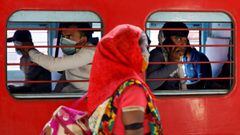 Migrant workers, who were stranded in the western state of Gujarat due to a lockdown imposed by the government to prevent the spread of coronavirus disease (COVID-19), sit inside a train as they leave for their home state of Uttar Pradesh, in Ahmedabad, I