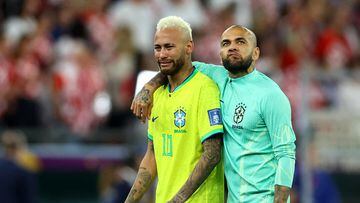 Soccer Football - FIFA World Cup Qatar 2022 - Quarter Final - Croatia v Brazil - Education City Stadium, Doha, Qatar - December 9, 2022 Brazil's Neymar and Dani Alves look dejected after losing the penalty shootout REUTERS/Hannah Mckay     TPX IMAGES OF THE DAY
